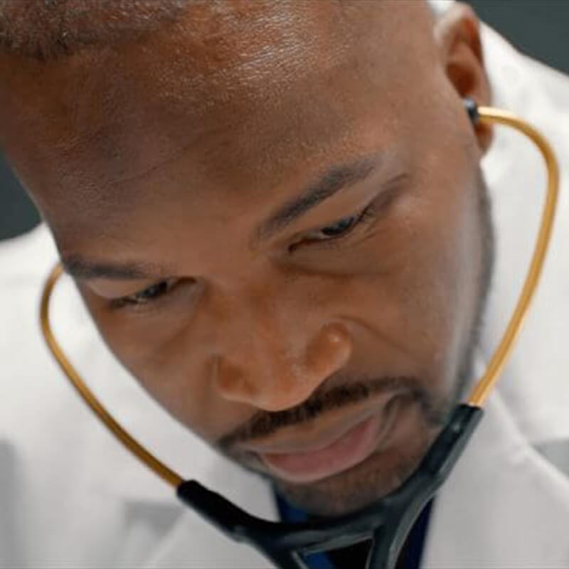 Doctor Examingin Patient